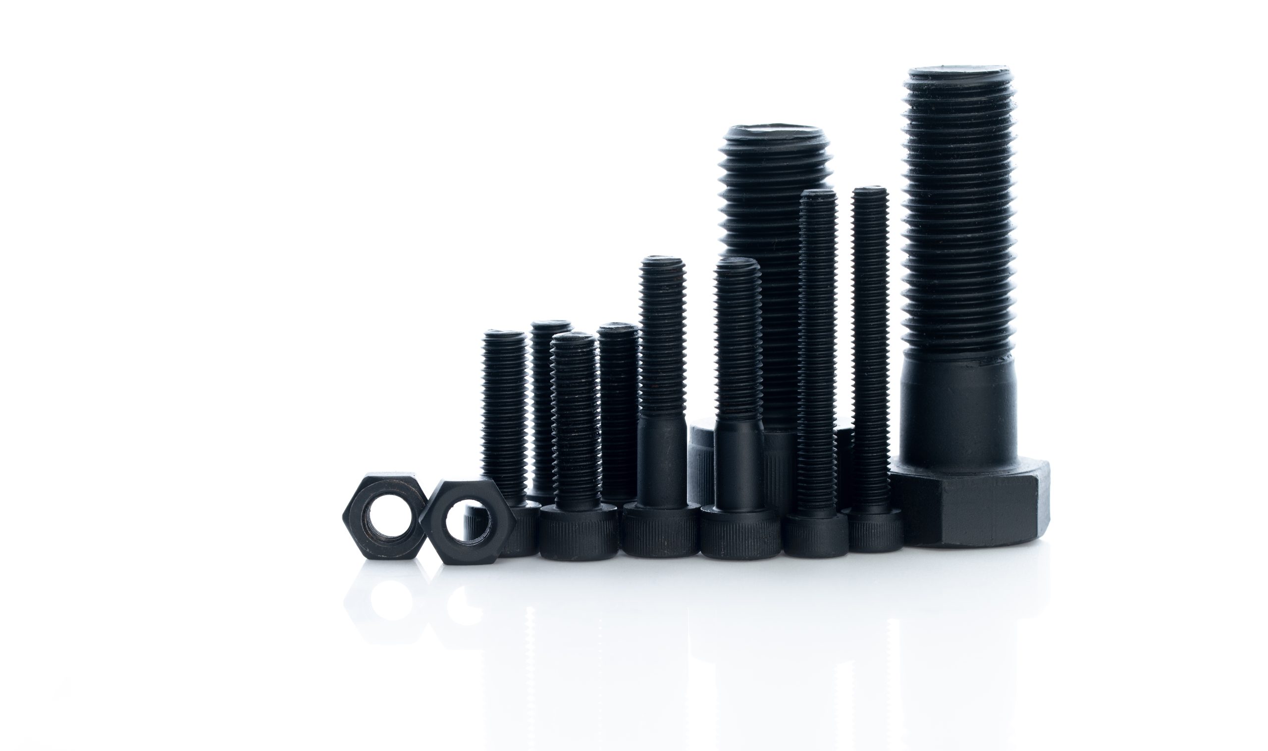 Black bolts and nuts isolated on white background. Industrial fa