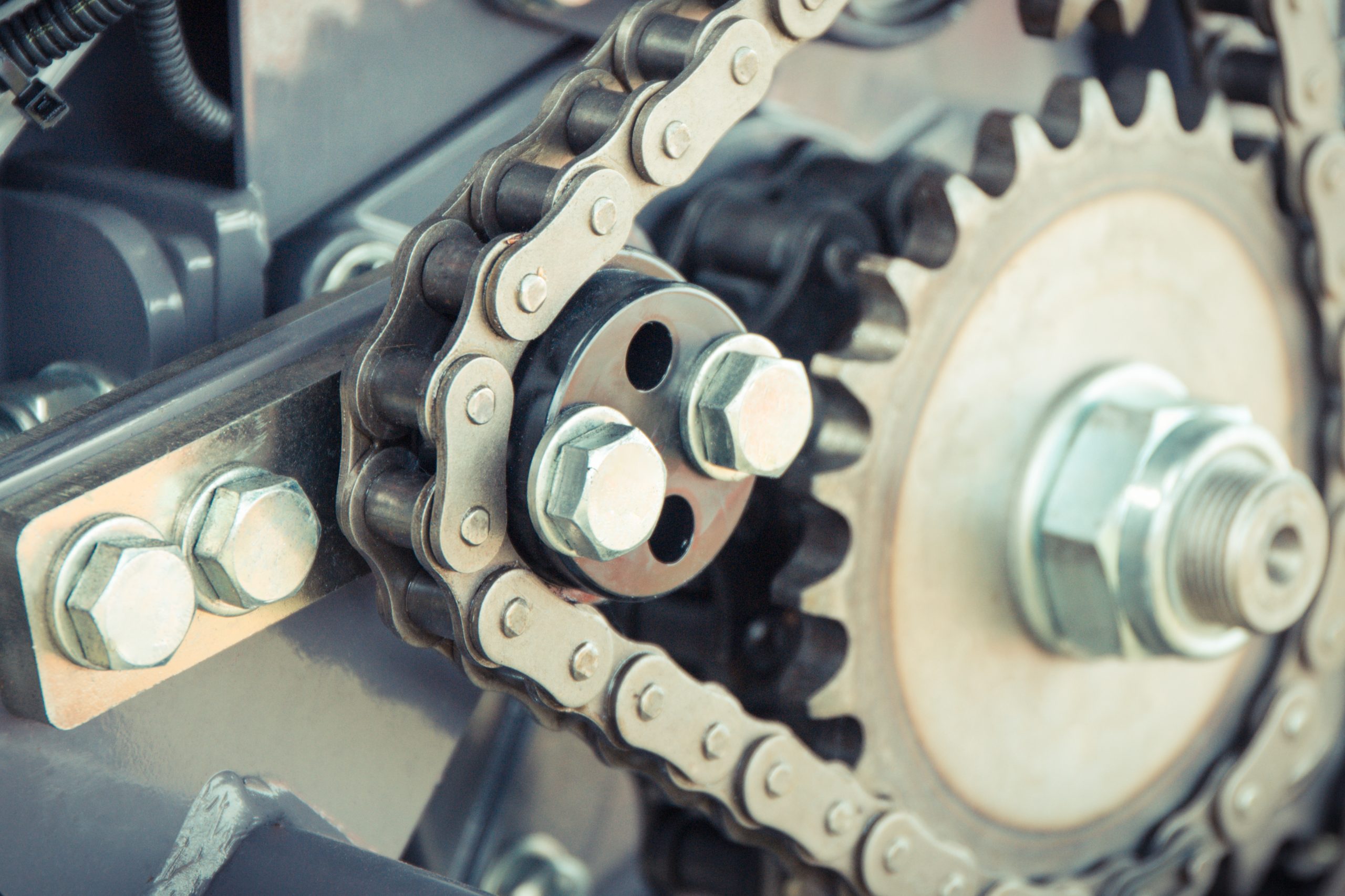 Metal chain and gear as part of agricultural and industrial machine. Technology